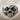 Zombie Skull Ring, oxidized silver, front product view on fabric