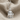 Kybele Goddess Earring, polished silver, front view on fabric