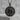 Scales of Justice Libra Pendant, black rhodium, product photo on stone