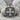 Acanthus Scroll Cross Pendant, oxidized silver finish, product view on rock