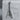 Flying V Electric Guitar Pendant, oxidized silver, product photo on concrete display