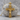Saint Benedict Crucifix Pendant, gold vermeil, product photo on stone base