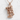 Rescue Combat Medic Pendant, rose gold, front view on textured surface