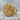 Flower Signet Ring, gold vermeil, angled view on stone base