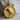 Nefertiti Medallion Pendant, gold vermeil, front view on wood block