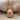 Hospitality Pineapple Pendant, rose gold, front view on linen