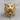 Tiger Hunter Skull Ring, gold vermeil, front view on wood surface