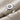 Star Set Signet Ring, oxidized silver, front view on textured fabric