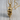 Broken Skull Pendant, gold vermeil, product photo on wood surface
