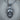 Beanie Skull Pendant, oxidized silver, product photo on wood