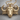African Buffalo Pendant, gold vermeil, front view on wood surface