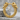 Wolf Hoop Earring, gold vermeil, front view on stone surface