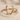 Wishbone Deer Antler Ring, gold vermeil, front view on sand