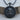 Jesus Christ Medallion Pendant, black rhodium, front view on wood