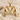 Bird Letter M Pendant, gold vermeil, front view on beach sand