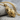 Grenade Heart Pendant, gold vermeil, product photo resting on stone