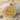 Gemini Zodiac Medallion Pendant, gold vermeil, front view on stone and sand