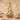 Gemstone Wing Swan Pendant, gold vermeil, angled front view on sand