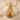 Horus Falcon Pendant, gold vermeil, front view on seashell