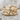 Serpent Cuff Earring, gold vermeil, front view on stone surface