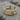 Arrow Cuff Earring, gold vermeil, front view on stone surface