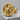 Winged Scarab Earring, gold vermeil, product photo on stone