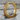 Greek meander hoop earring, gold vermeil, product photo on stone