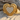 Braided Heart Ring, gold vermeil, product photo on sand