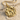 Aquarius Water Bearer Pendant, gold vermeil, product photo on beach sand