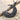 Scroll Crescent Star Pendant, black rhodium, angled view on sand with driftwood