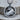 Rearing Taurus Zodiac Pendant, oxidized silver, product photo on wood