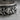 Intertwined Skull Ring, oxidized silver, close-up of skull relief detail