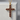 Ruby cross pendant, gold vermeil, front product view on stone pedestal