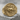 Chariot Coin Ring, gold vermeil, front view on stone surface