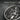 Saint Catherine Medallion Pendant, oxidized, angled close-up of wheel and figure relief