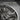 Saint Isidore of Seville Pendant, oxidized, close-up of saint figure and quill