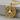 Squared Circle Pendant, gold vermeil, angled wood surface display