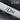 Wavy Slide Tie Bar, oxidized silver, angled close-up on slate