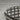Yaki Onigiri Pendant, oxidized silver, angled close-up view of grill marks