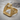 Stirrup Tread Arch Ring, gold vermeil, angled studio view