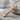 Stipple Panel Tie Clip Accessory, rose gold plated, product view on stone surface