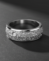 Side angle of the handcrafted silver lunar crater ring, showcasing the high-contrast texture against the smooth, polished comfort-fit edges.