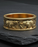 14K gold vermeil silver polar bear ring with intricate animal relief carving on dark slate background