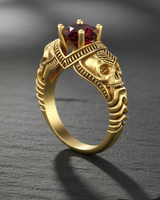 14K gold vermeil skull engagement ring with square red gemstone displayed on dark stone texture