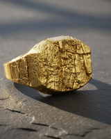 Detailed close-up of handcrafted silver ring with rugged stone effect and irregular cracks for unique men's style