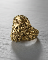 14K gold vermeil silver Poseidon ring featuring Greek god face and trident side detail on grey background