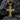 Sacred 14K gold vermeil Jesus crucifix pendant resting elegantly on dark textured stone highlighting its 3D details.
