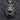 Front view of 925 silver roaring lion head pendant with dark vintage finish displayed on textured grey fabric