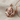 Clawing Lion Pendant in rose gold, front detail resting on fabric