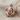 Clawing Lion Pendant in rose gold, front detail resting on fabric